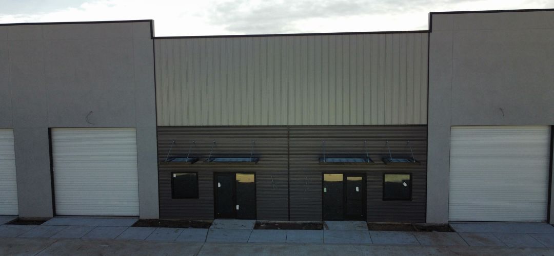 Office/warehouse units with grade-level roll-up doors at Pin Oak, Westheimer Parkway, Katy TX